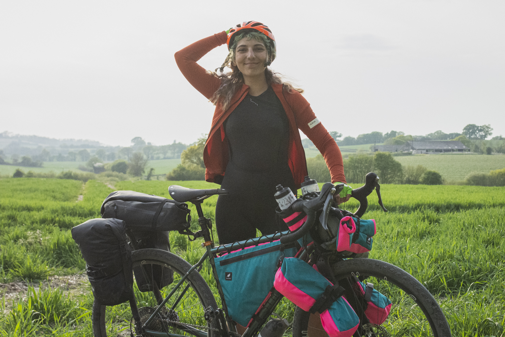 Zara posing with her loaded bike on the South Downs Way