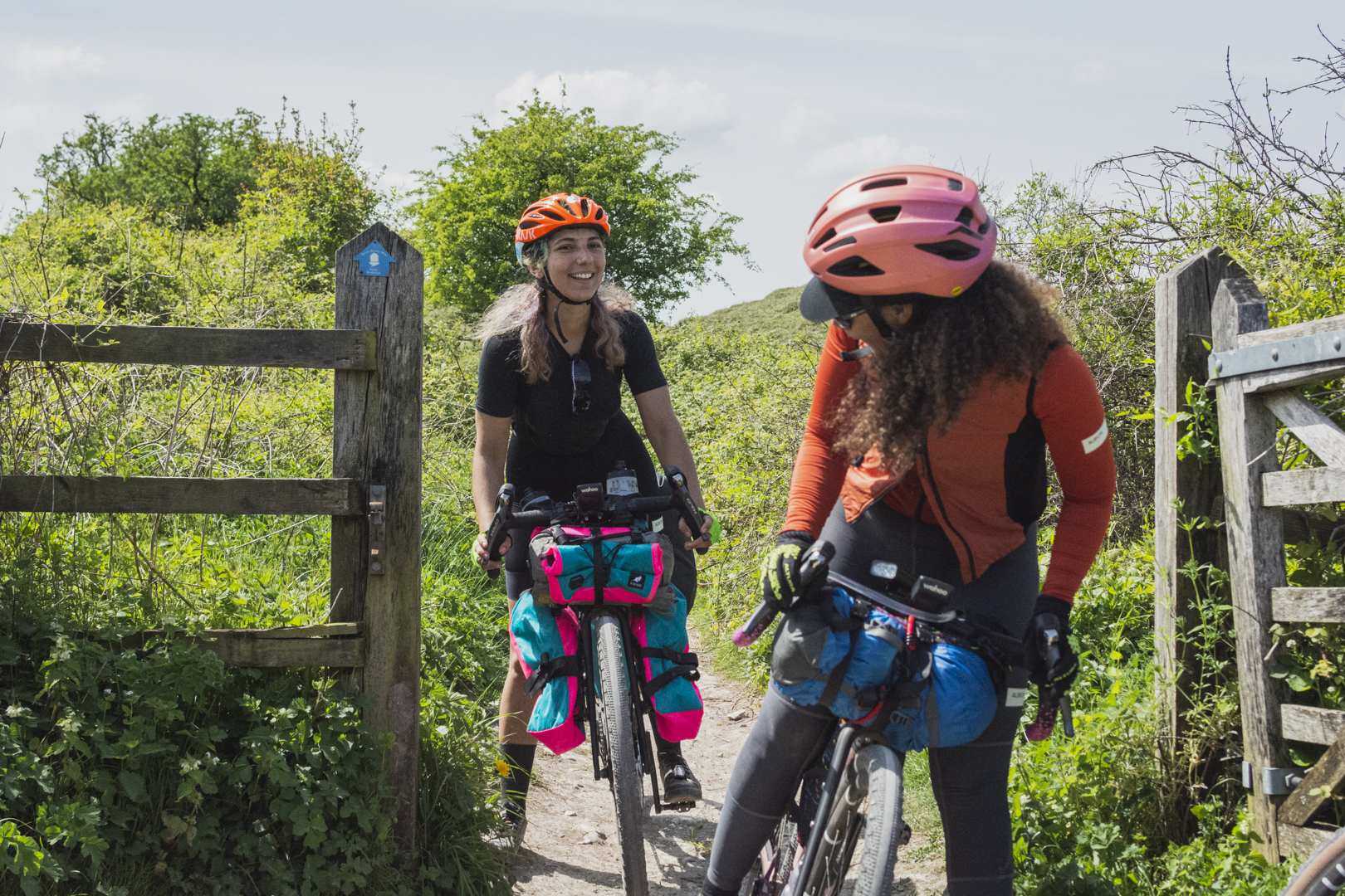 Zara and Carla navigating a gate on the South Downs Way
